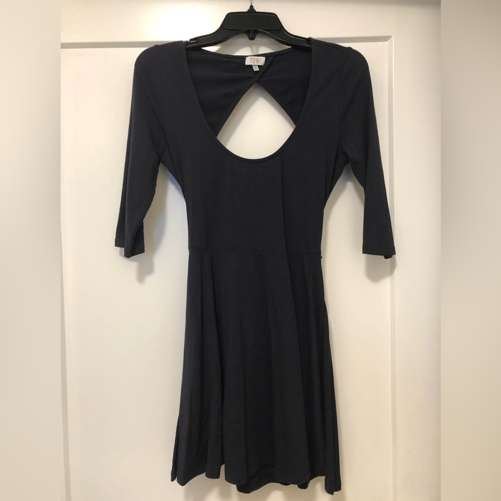 Navy blue mini dress with 3/4 sleeves and open back with a bow